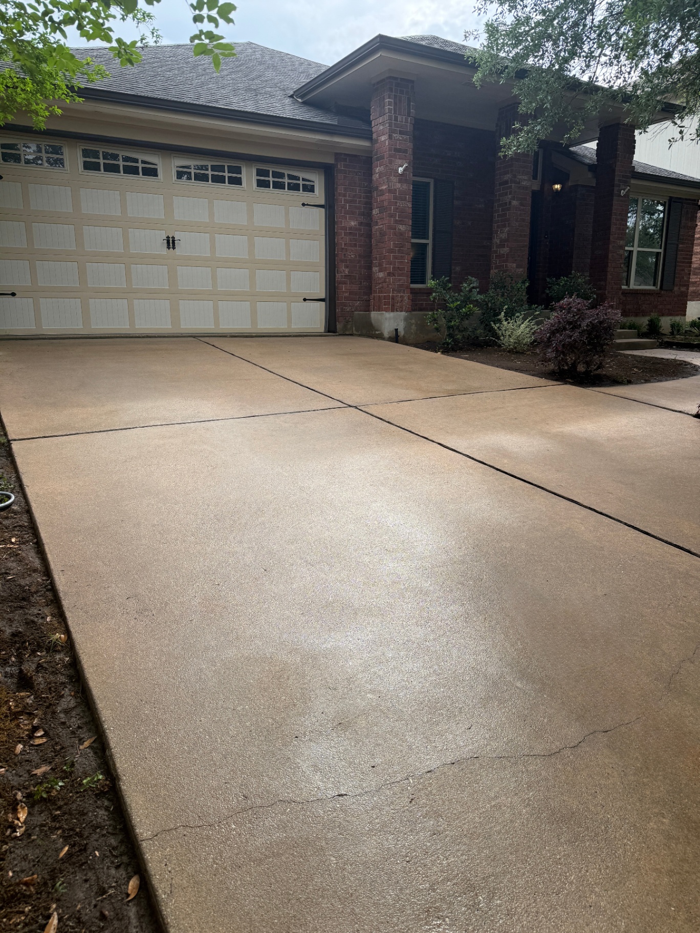 Same driveway after Rinse Bros power washing