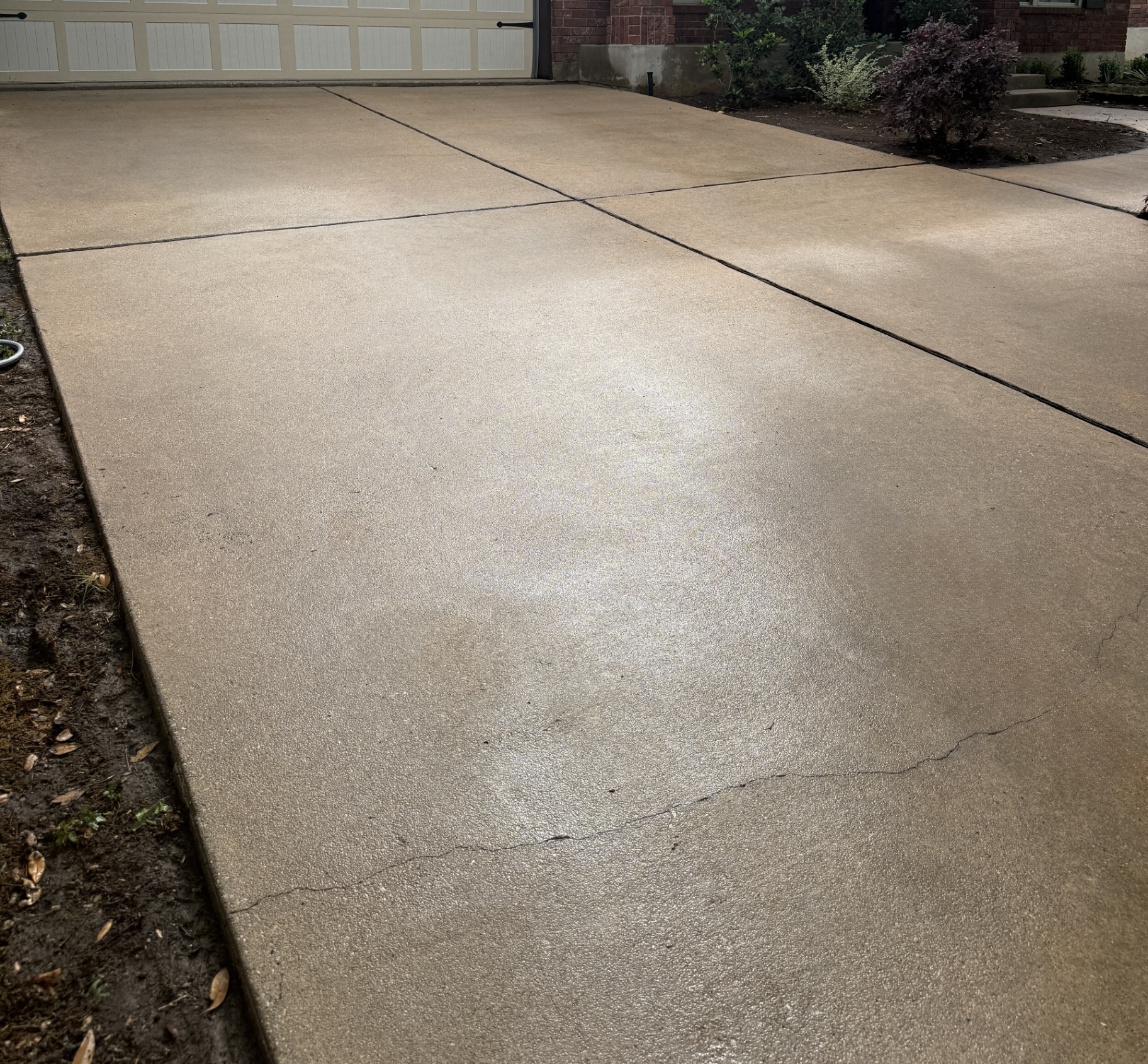 Same driveway after Rinse Bros power washing
