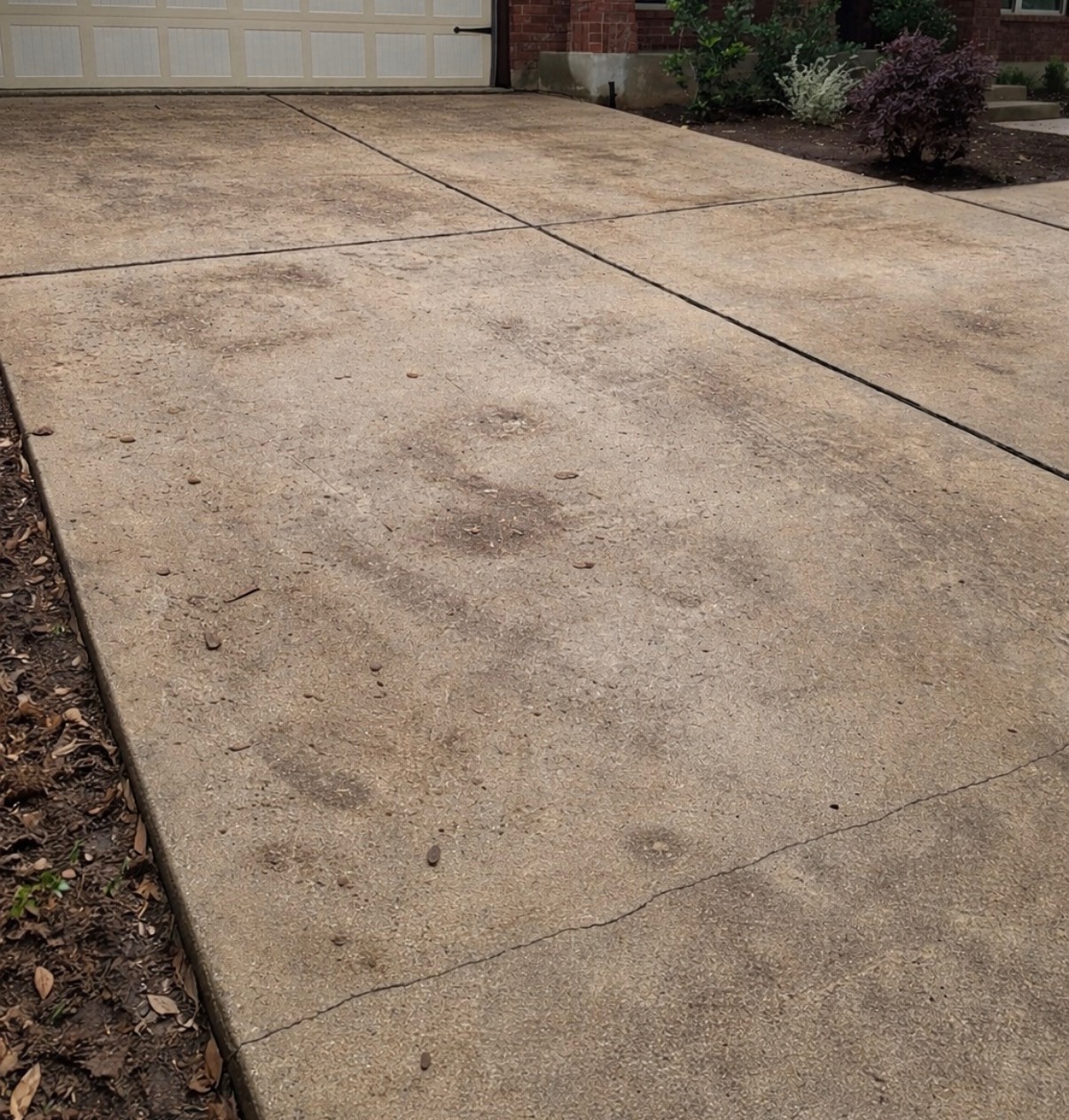 Dirty Austin driveway before power washing